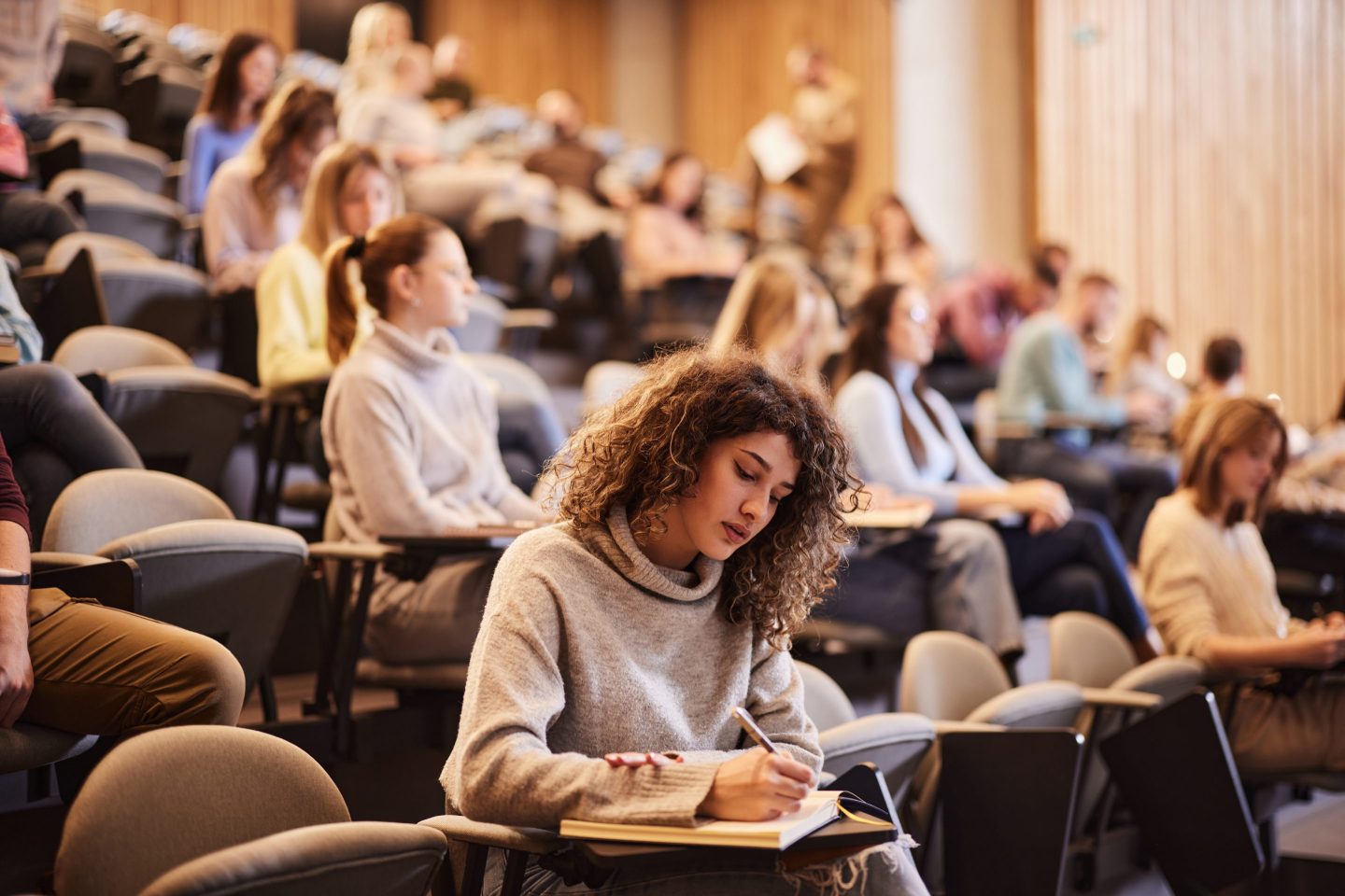 College student studies in classroom.